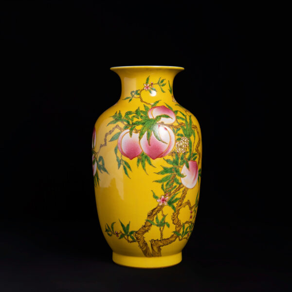 (From an Old Collection) Yellow-Ground Famille Rose Vase with Eight Peaches Design
