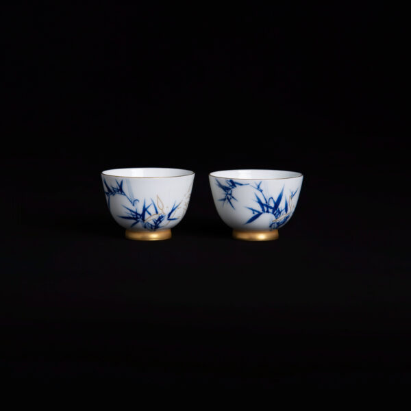 (From an Old Collection) Blue and White "Bamboo and Rocks" Palace Cup with Gilt Accents