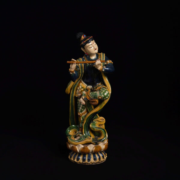 (From an Old Collection)Three-color Glazed Standing Figure of a Musician Playing a Flute and Dancing with Heavenly Spirits