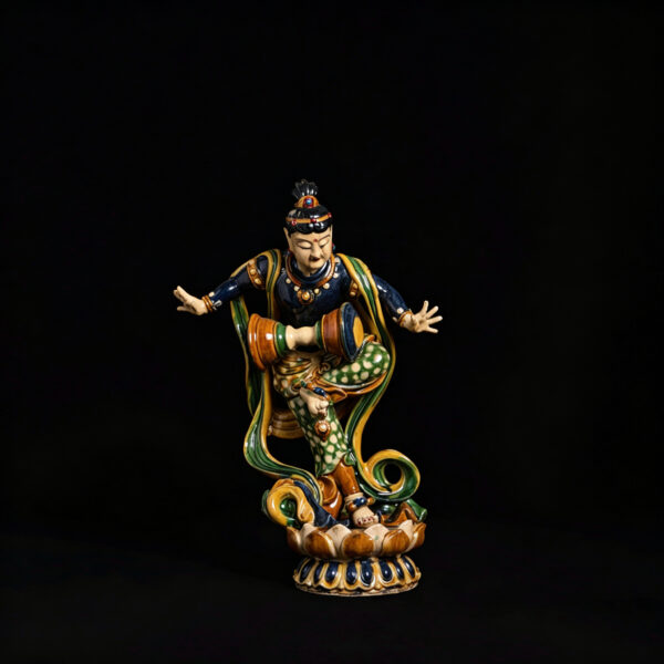 (From an Old Collection)Three-color glaze statue of a dancing celestial being holding a drum and standing upright