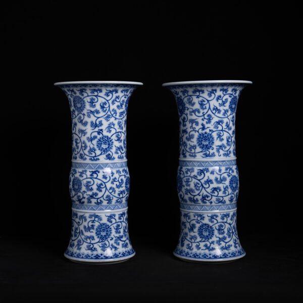 (From an Old Collection) A pair of blue-and-white vases with scrolling lotus patterns
