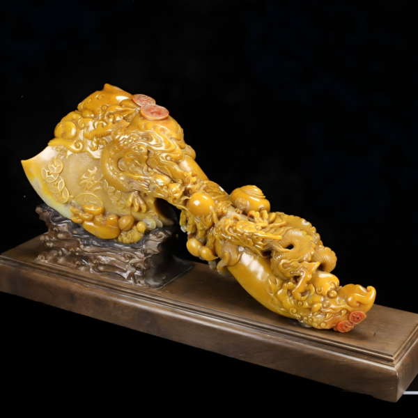 Taihu stone, golden yellow and exquisite, with a dragon depicted on the top.