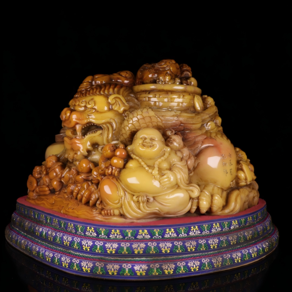 Red and white "Tianhuang" stone with a "Lemur Buddha" figure
