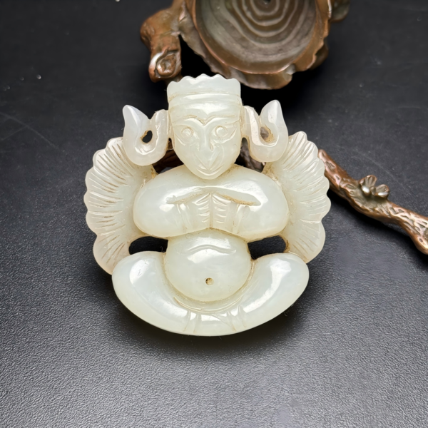 Lacquered jade piece in the form of Garuda with hollowed-out design